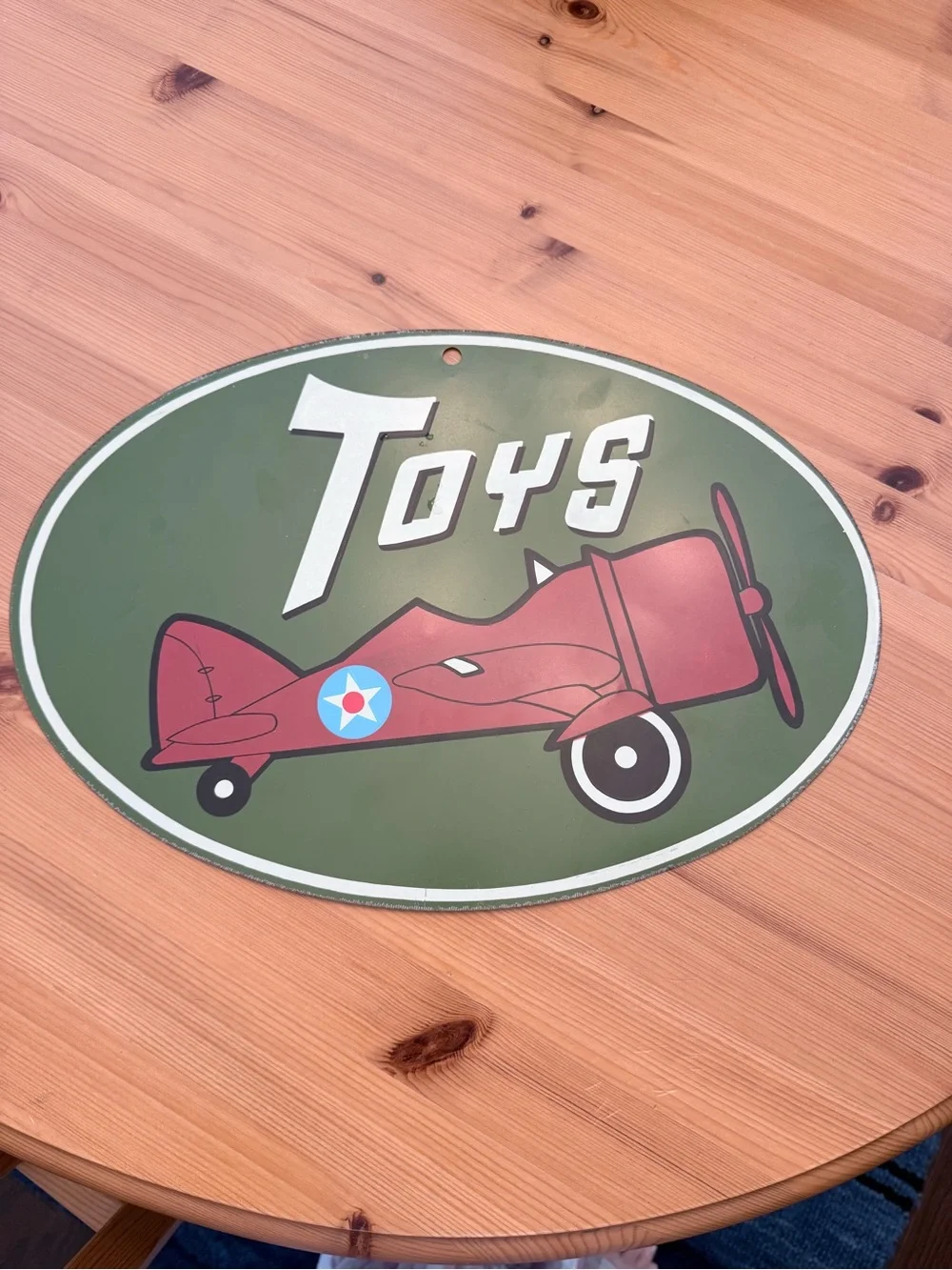 Target Red Airplane 'Toys' Oval Wall Sign on Green